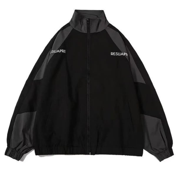 Unisex sportjacka med dragkedja, kontrastpaneler och resår i nederkant. Lätt jacka för stan och träning. Streetwear-stil. svart S