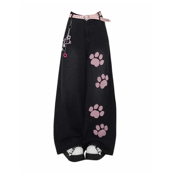 Dam svarta vida jeans med rosa tassar på benet i lång längd kompletterade med hög midja, bälteshällor och framfickor M