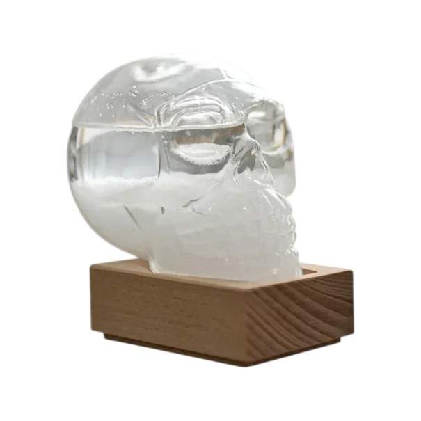 Bouřkové sklo Storm Glass ve tvaru lebky 10 x 9 cm Skleněný barometr s krystaly na dřevěném podstavci Dekorace na stůl průhledná