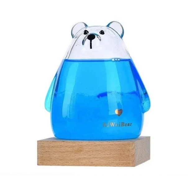 Bouřkové sklo Storm Glass ve tvaru ledního medvěda 8 x 12 cm Skleněný barometr s krystaly na dřevěném podstavci Dekorace modrá