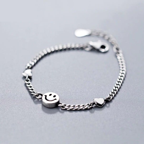 Damesarmband met smiley en hartjes 1