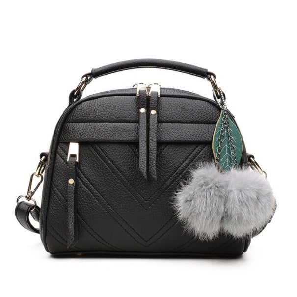 Dams crossbody-väska med övre handtag och dekorativ nyckelring med pom-poms Främre ficka med dragkedja PU-läder och polyester 22 x 20 x 11 svart