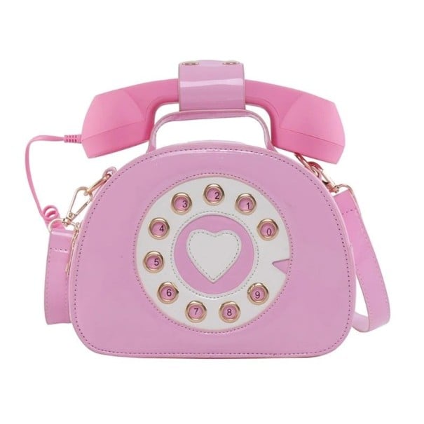 Dams crossbody-väska i form av en retrotelefon Nummerskiva med hjärta och hörlurar med snodd PU-läder och polyester 21 x 16 x 9 cm rosa
