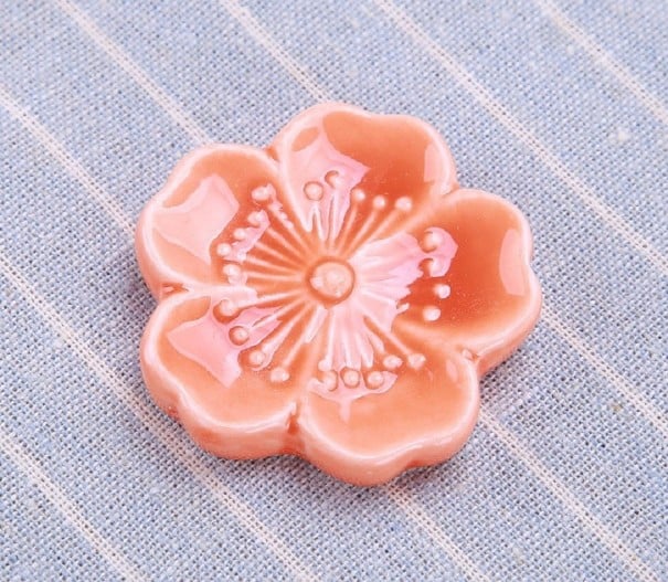 Soporte para palillos con forma de flor salmón