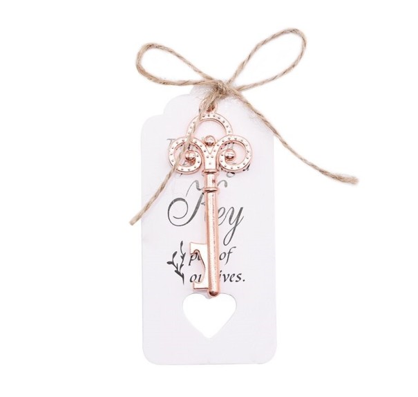 Abridor de botellas decorativo con forma de llave rosa