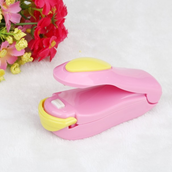 Ajutor pentru închiderea pungilor de plastic J2957 roz