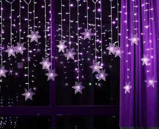 Catena luminosa LED fiocchi di neve viola