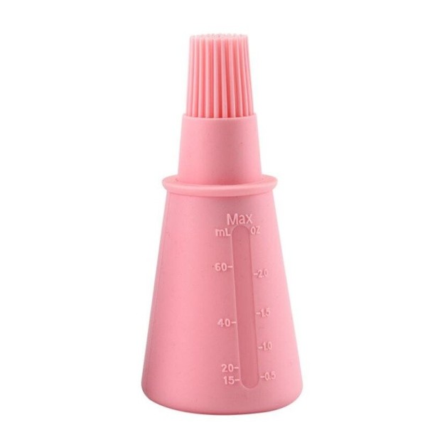 Cepillo de silicona con depósito de aceite. rosa claro