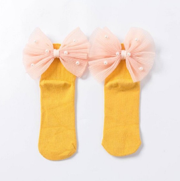 Chaussettes pour filles avec un grand nœud et des perles jaune 1-3 ans