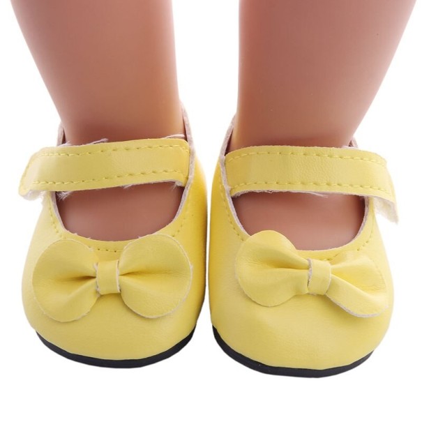 Chaussures avec nœud pour poupée jaune