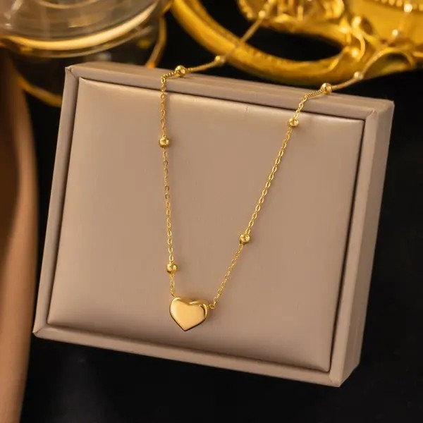 Choker dourado feminino em aço cirúrgico com pendente de coração integrado 1