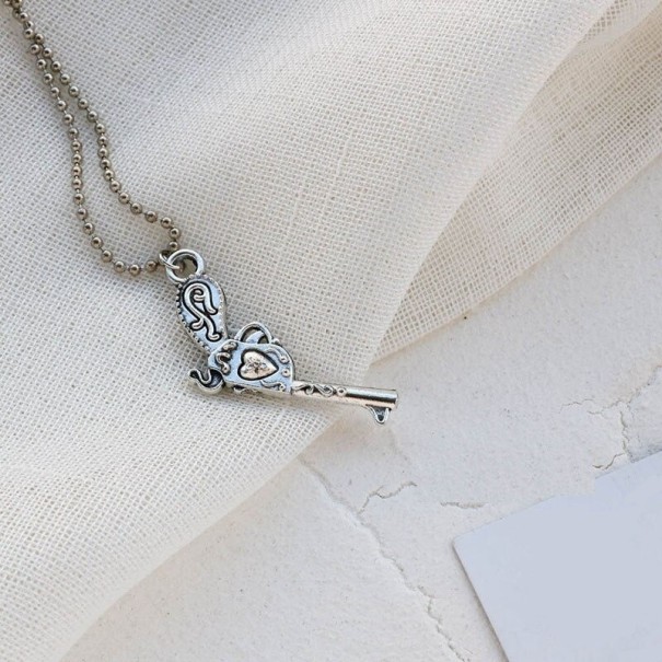 Collar de mujer con colgante de pistola 60 cm 3