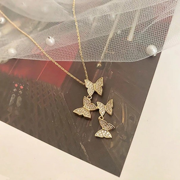 Collier pour femmes avec des papillons D670 doré