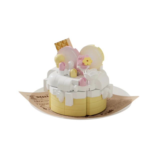 Costruzione di una torta nei colori bianco e giallo con decorazioni di mattoncini a forma di cupole, fiori e biscotti 5,5 x 3,5 x 4,5 cm Modello 1