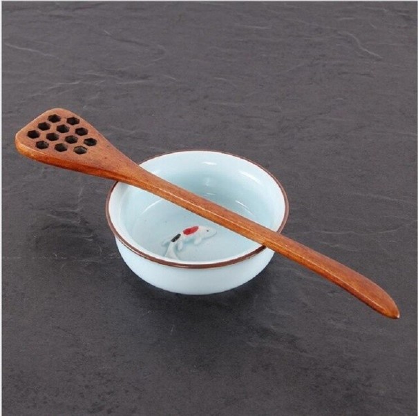 Cuillère en bois pour le miel marron foncé