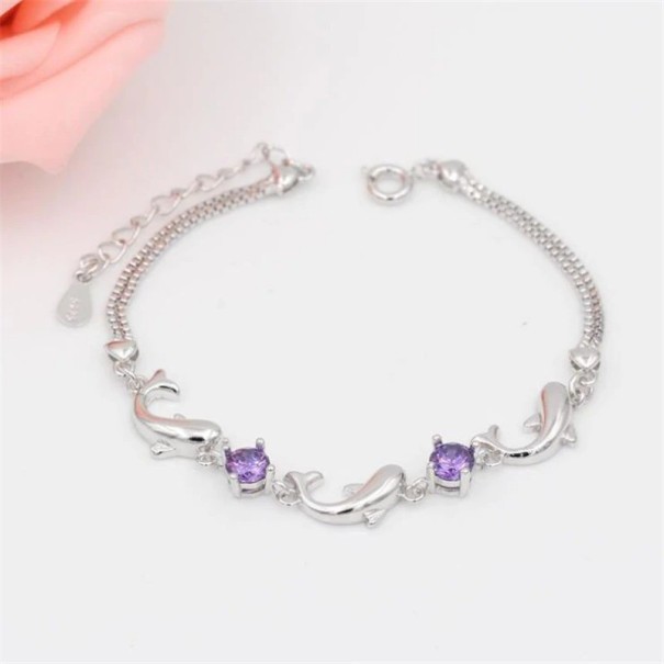 Damarmband med delfiner lila