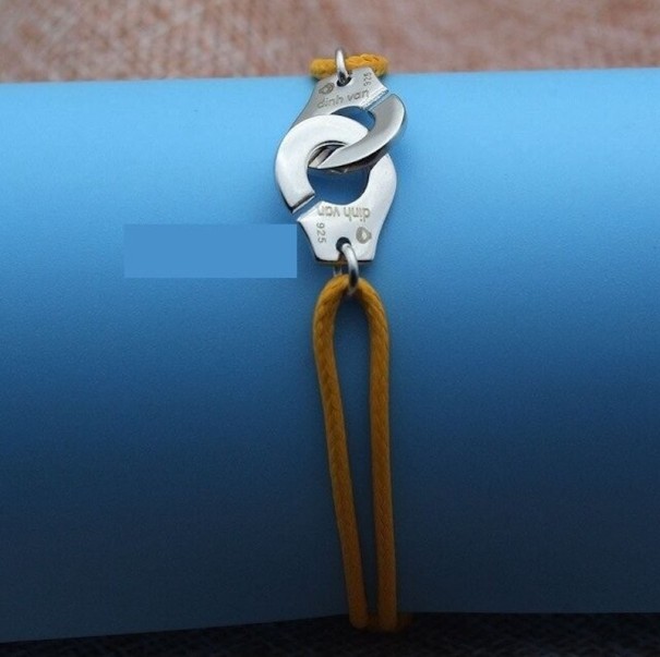 Damarmband med handbojor mörkgul