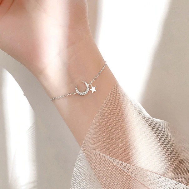 Damarmband med måne och stjärna