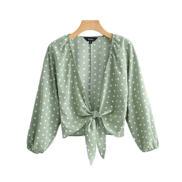 Dame lys grøn bluse med hvide prikker Dyb V-udskæring med binding foran Korte ærmer Lange ærmer med elastik Polyester M