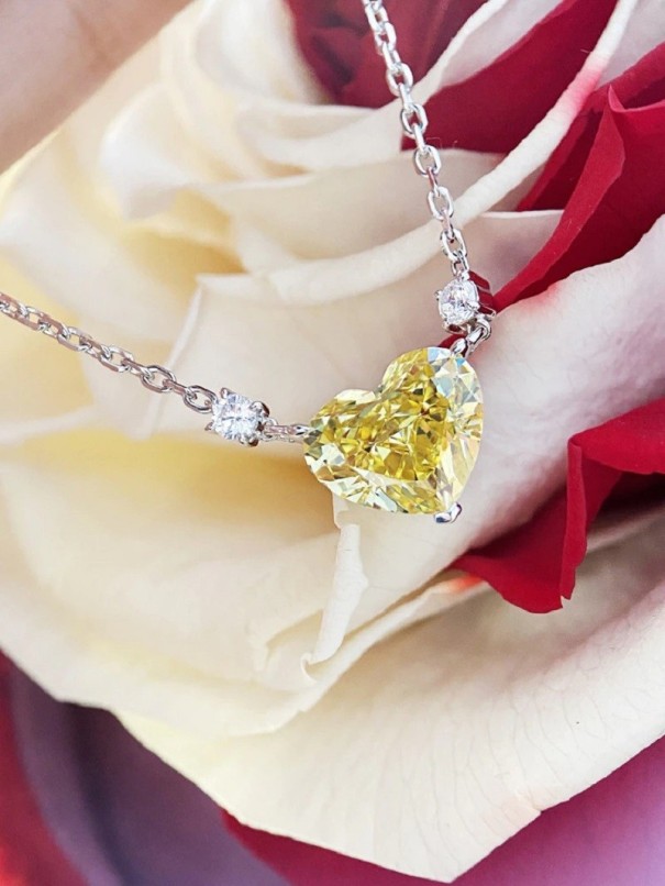 Dames hart ketting D746 geel