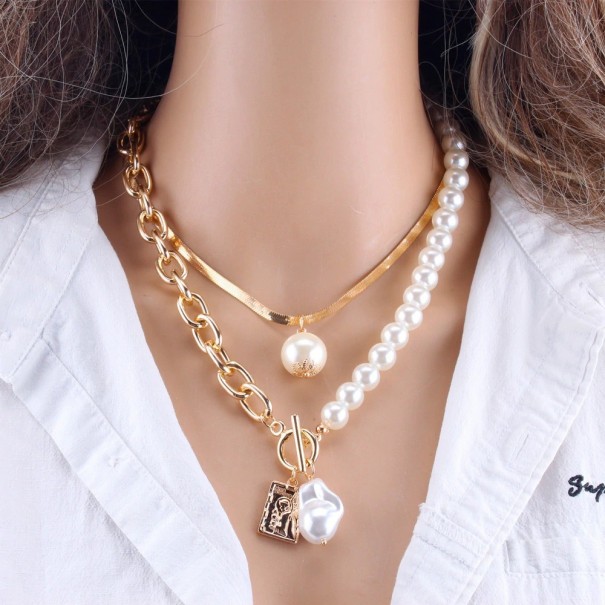 Dames massief parel collier G747 goud