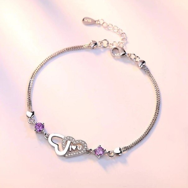 Damesarmband met verbonden harten en stenen H416 paars