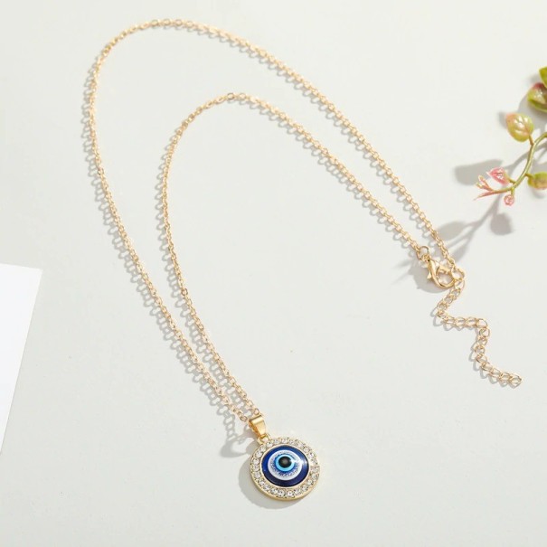 Damesketting met ooghanger goud