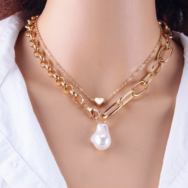 Damesketting met parel en hart goud