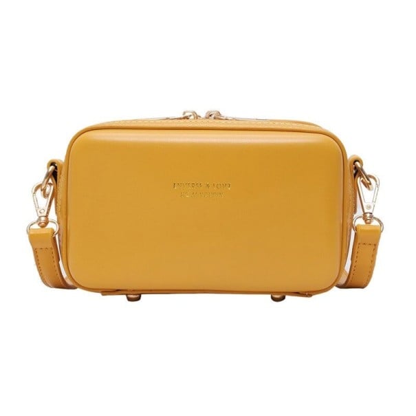 Dámská crossbody kabelka ve tvaru krabičky Zapínání na zip Kovové nožičky Nastavitelný popruh s karabinkami PU kůže 17 x 10 x 8,5 cm tmavě žlutá