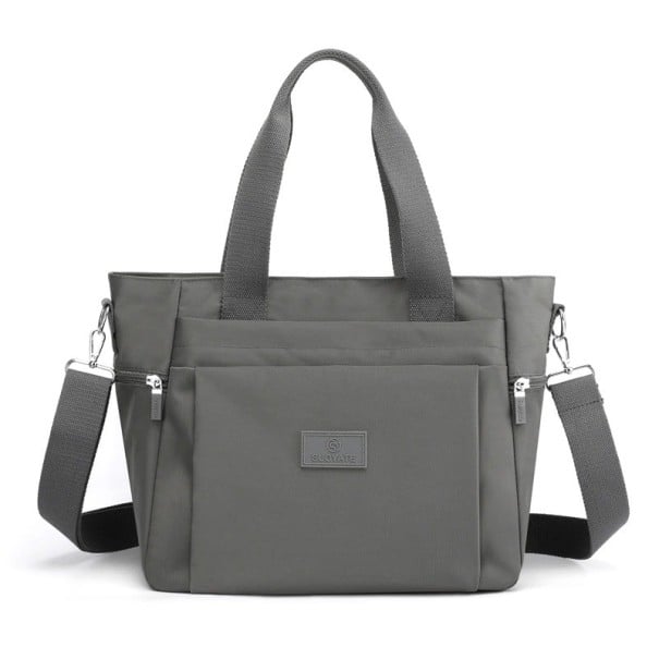 Dámska kabelka do ruky aj cez rameno Taška z nylonu a polyesteru s odnímateľným popruhom Predná kapsa Rozmery 30 x 27 x 16 cm sivá