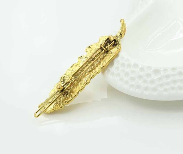 Dámský klip do vlasů - pírko zlatá