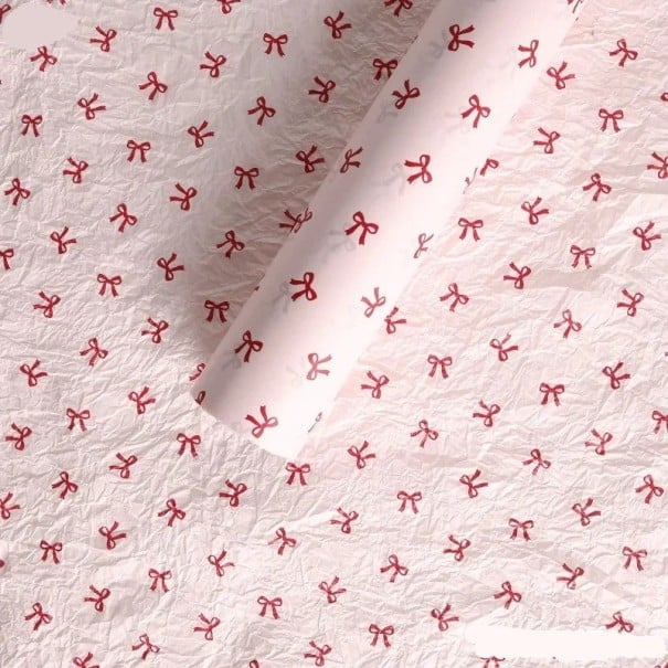 Dárkový balicí papír s motivem mašlí 50 × 70 cm dekorativní papír růžový pro balení dárků a kreativní tvoření 1