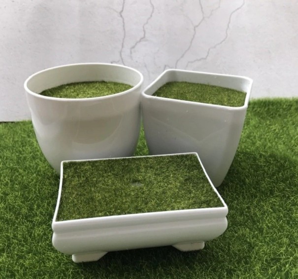 Decoratieve bloempot met kunstgras