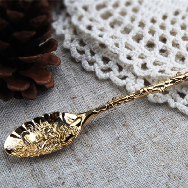 Decoratieve lepel met bloemen goud