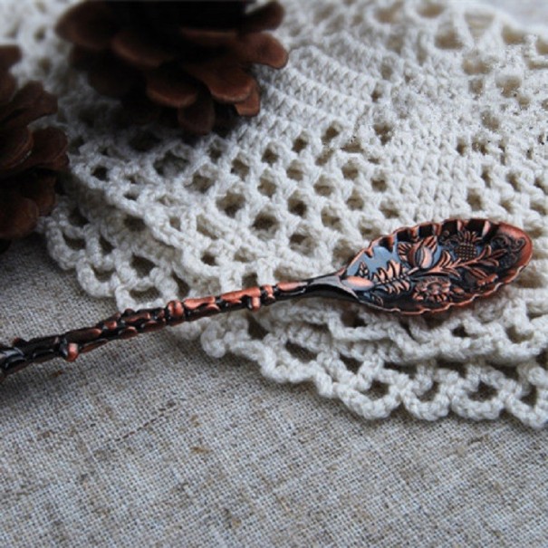 Decoratieve lepel met bloemen koper