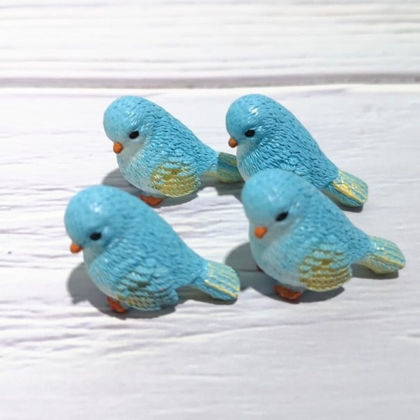 Decoratieve vogels 4 stuks lichtblauw