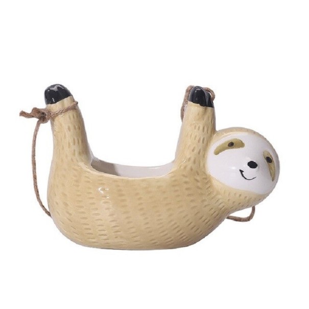 Dekorativ dovendyrformet blomsterpotte beige