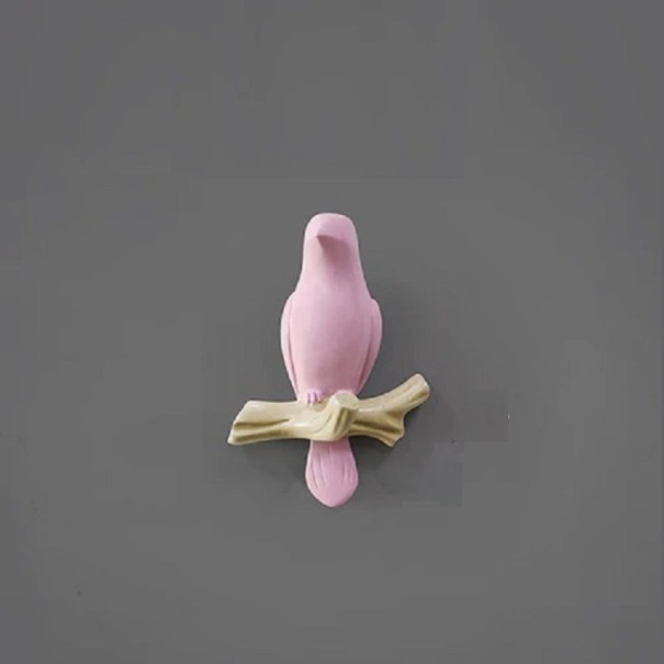 Dekorativer Haken in Form eines Vogels rosa