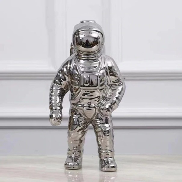 Dekorativní soška astronauta stříbrná L