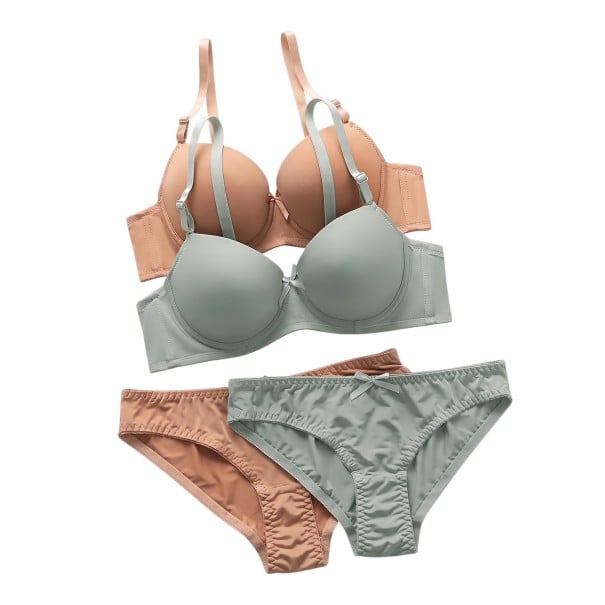 Due set di biancheria intima femminile in beige e menta, ciascuno con reggiseno push up e slip decorati con un piccolo fiocchetto S