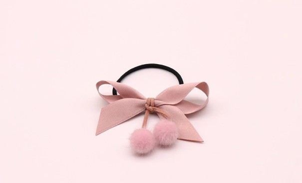 Élastique à cheveux avec nœud et perles rose