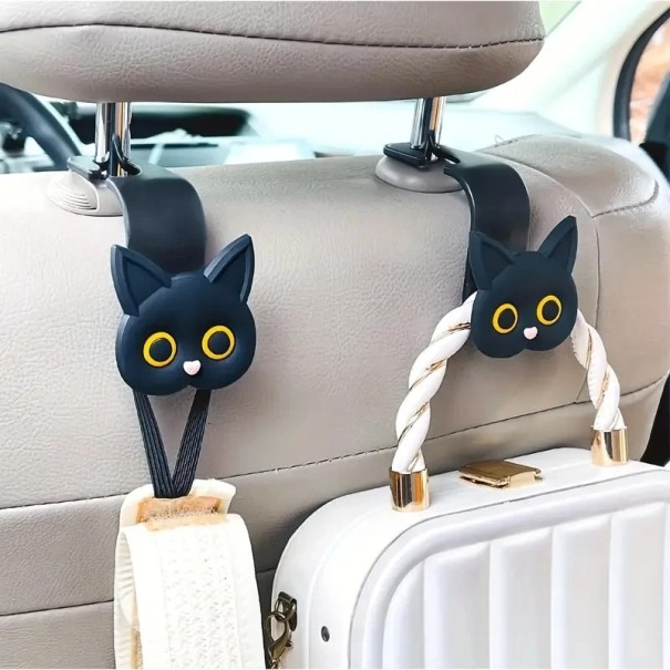 Ensemble de deux supports de voiture en forme de tête de chat pour appuie-tête comme si un chat tenait dans sa bouche un sac à main, des lunettes ou des vêtements en ABS noir