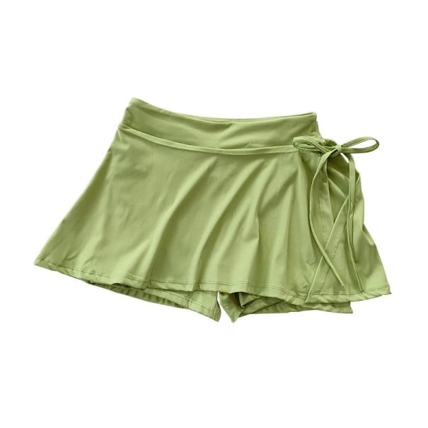 Falda deportiva corta para mujer de color sólido con lazo y bolsillos de nylon, material funcional ligero, falda con pantalones cortos internos verde S