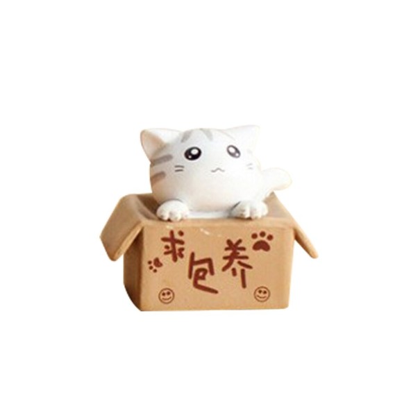Gato en miniatura decorativo en una caja blanco