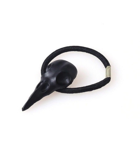 Gomme à cheveux avec crâne d'oiseau noir