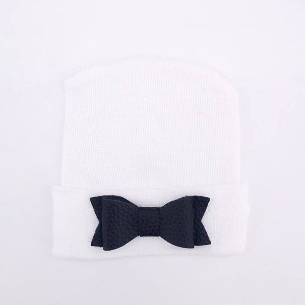 Gorro infantil blanco con lazo negro Gorro infantil blanco con lazo negro