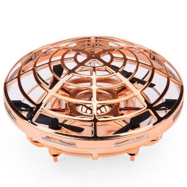 Handgesteuerte fliegende UFO-Drohne golden Handgesteuerte fliegende UFO-Drohne golden
