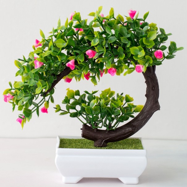 Konstgjord bonsai i en kruka rosa