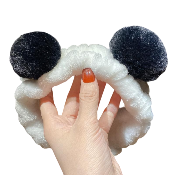 Kosmeettinen pääpanta pompomeilla musta