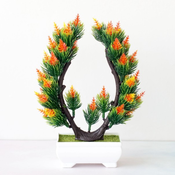 Kunststruik in een pot oranje